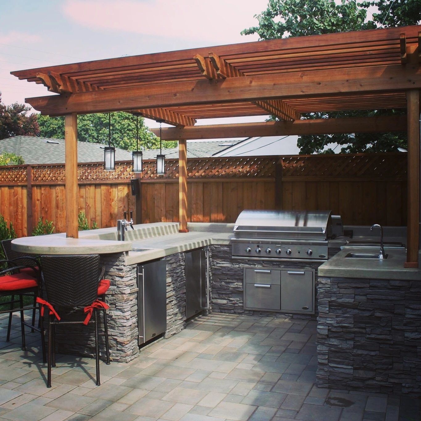 Backyard kitchen setup with stone counters