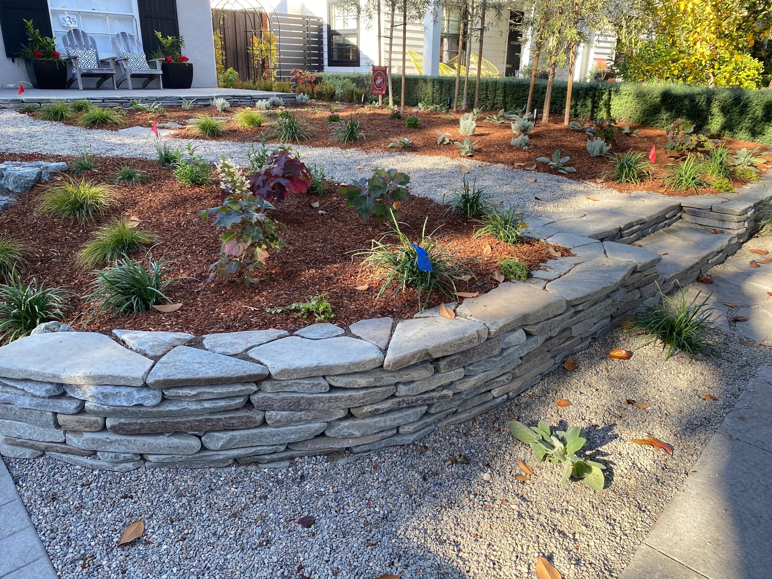 Tiered garden with mulch and plants