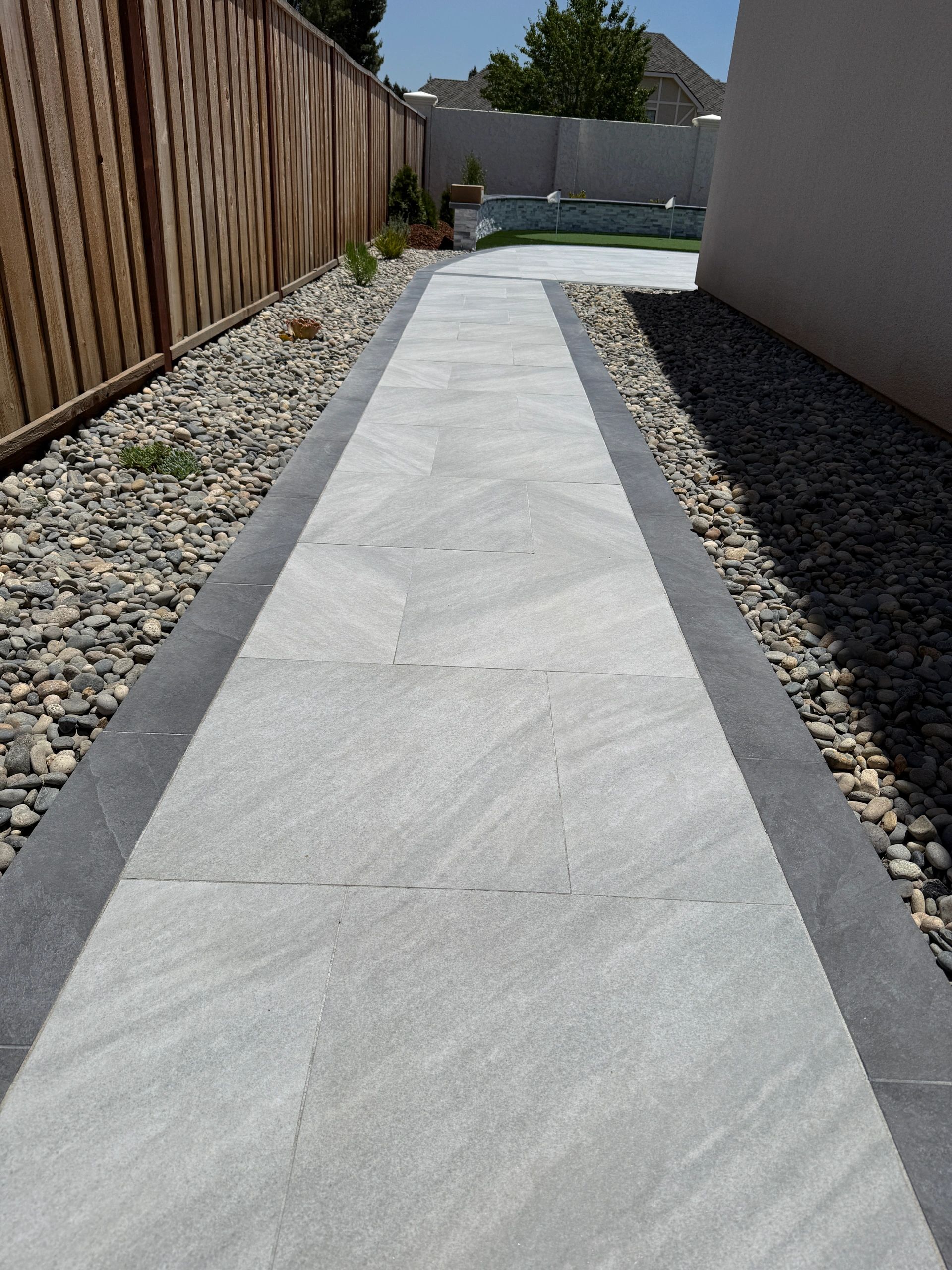 Modern garden walkway with rocks