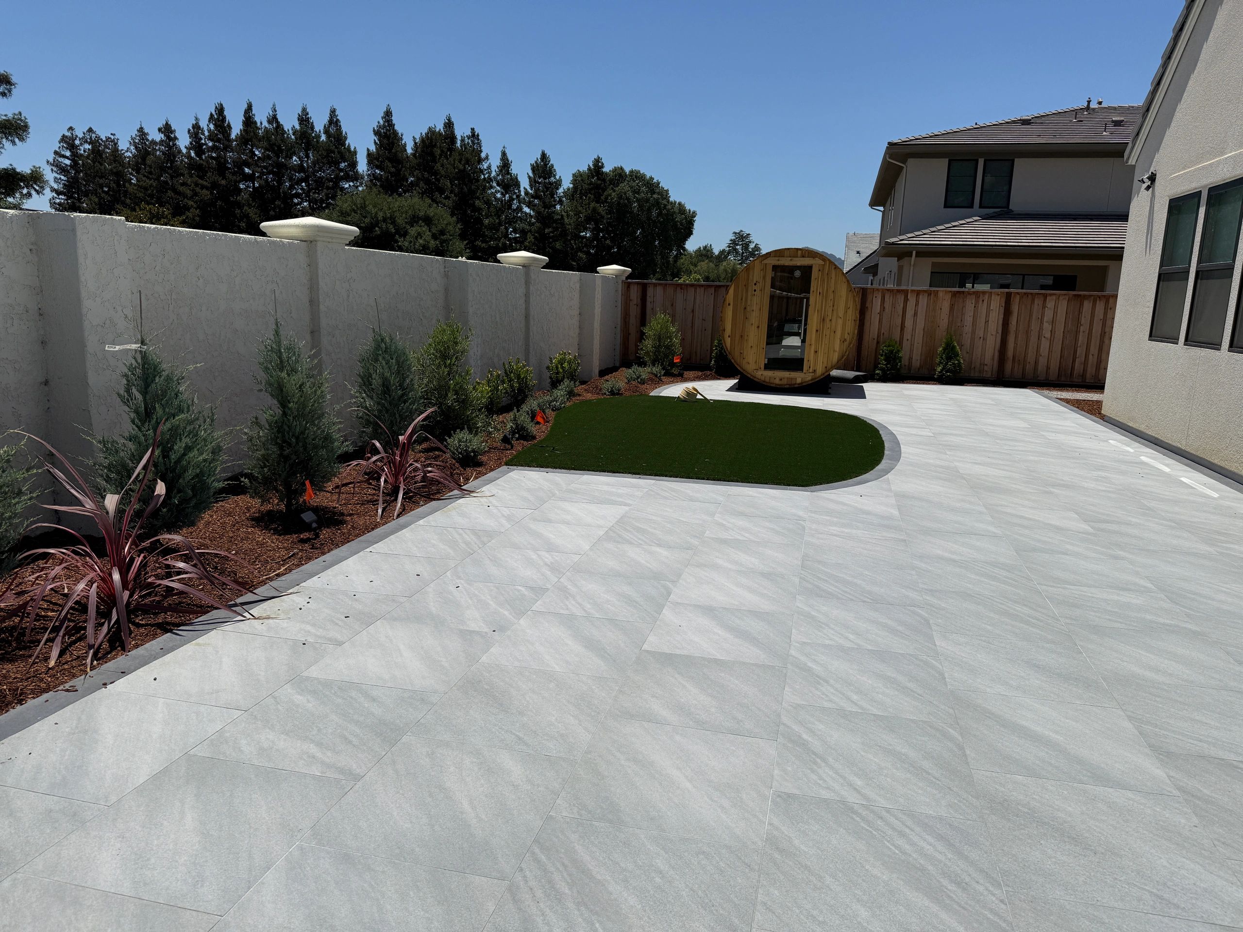 Spacious backyard with artificial grass area