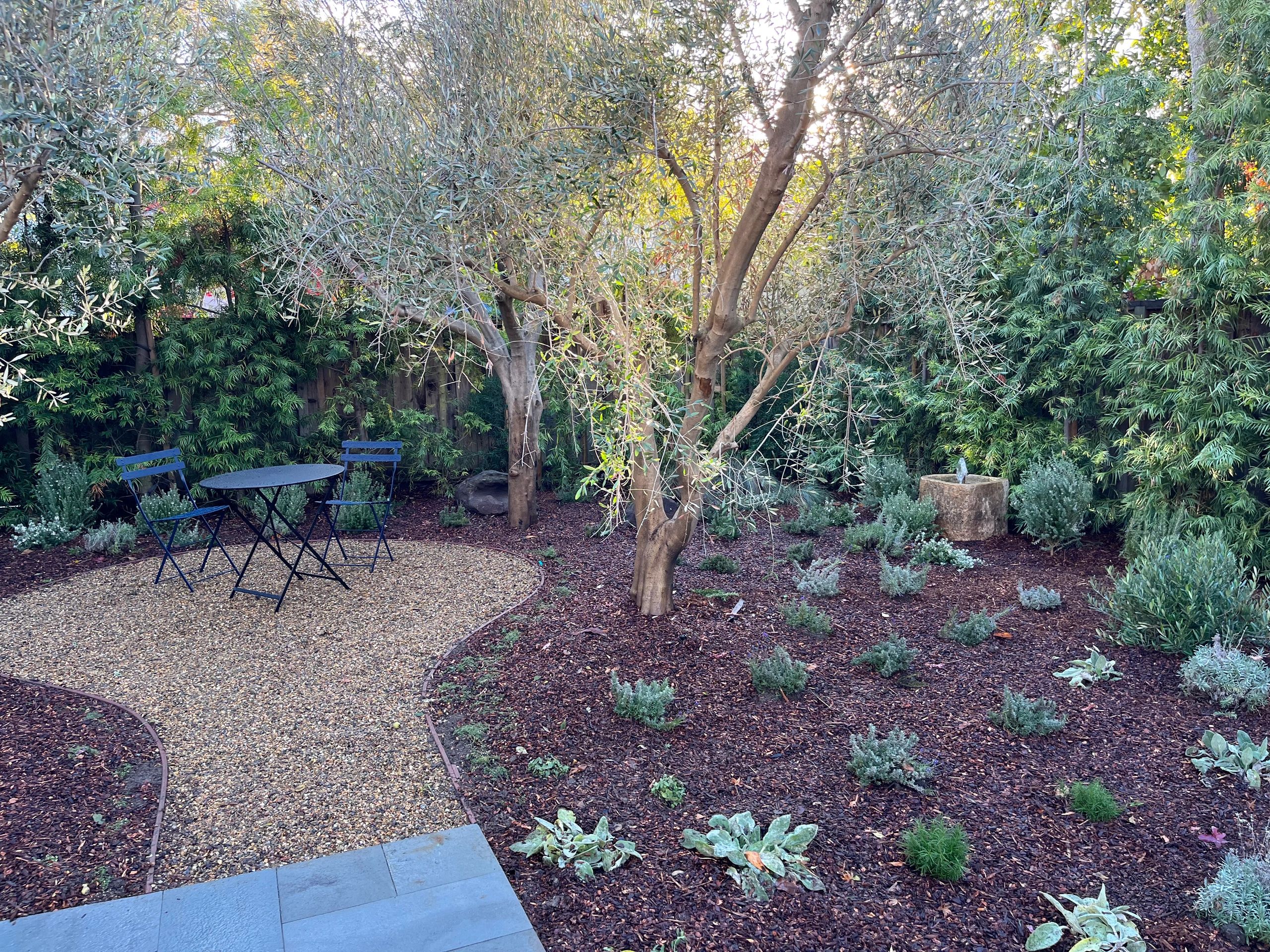 Peaceful garden featuring a small table set