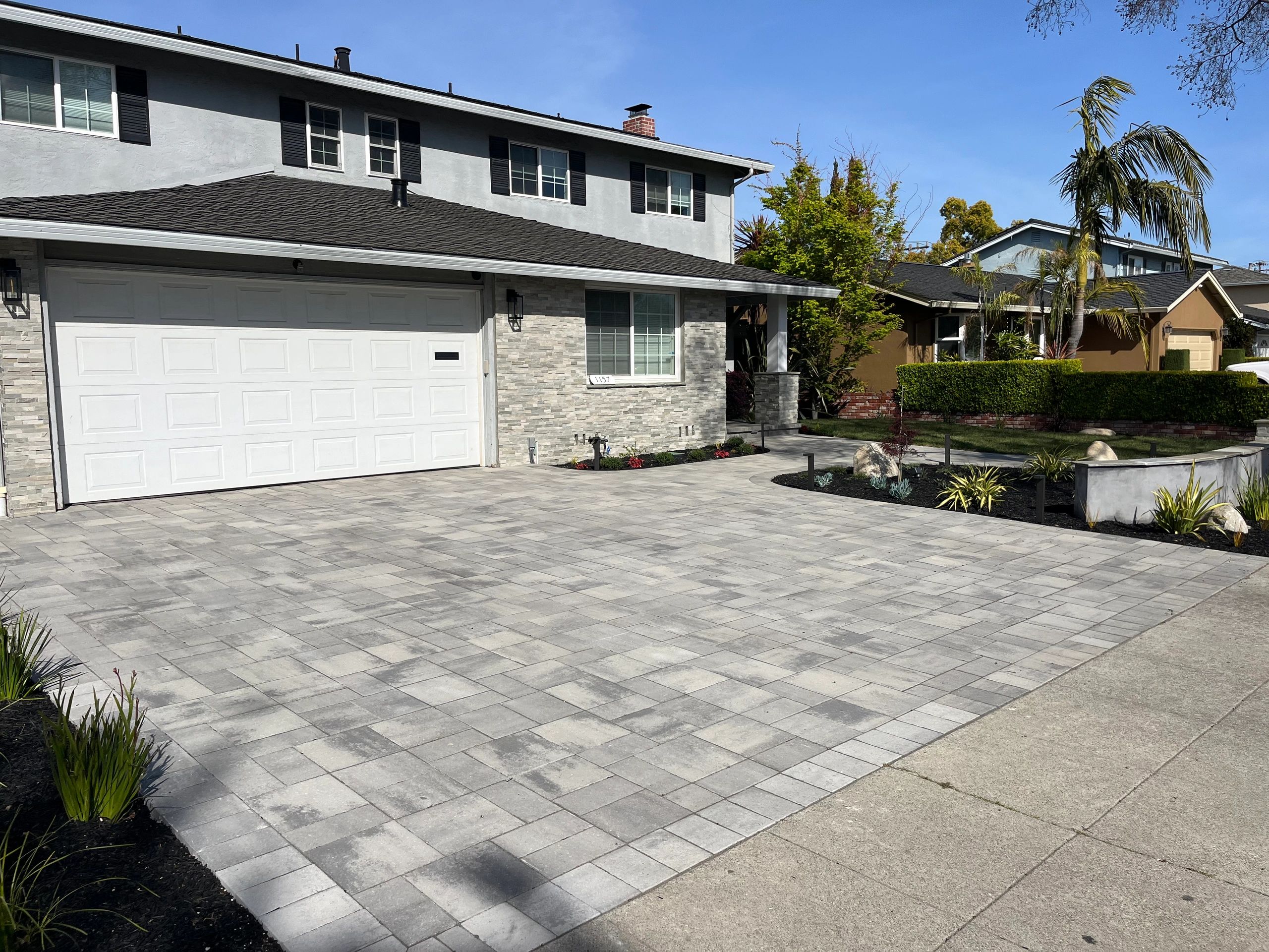 Modern home with driveway and garden