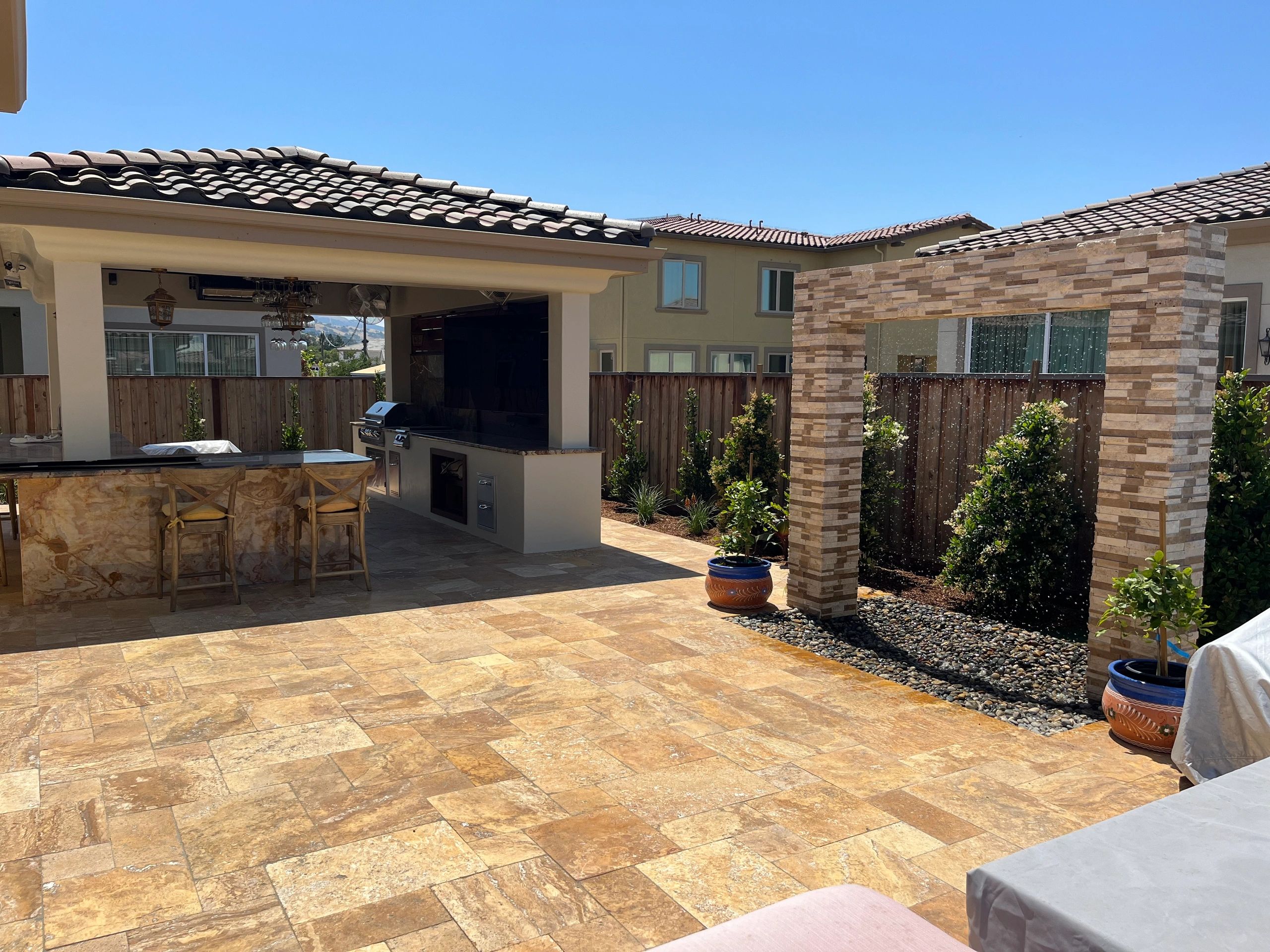 Modern backyard with covered bar area