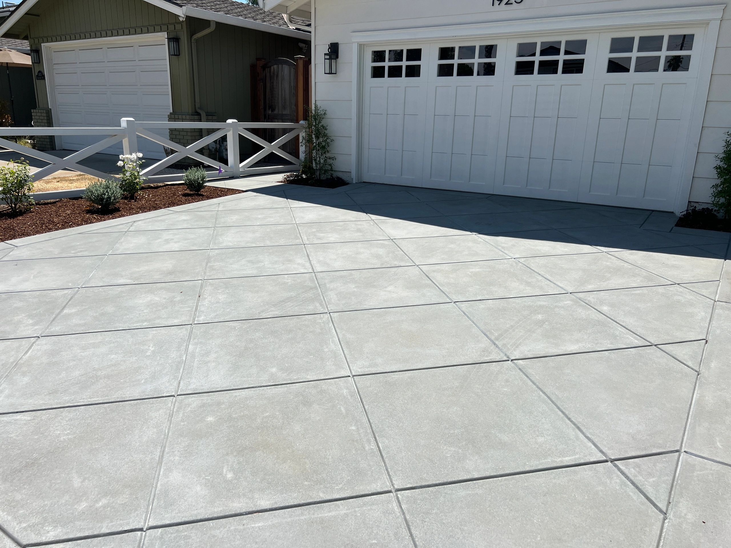 Concrete driveway with garage doors