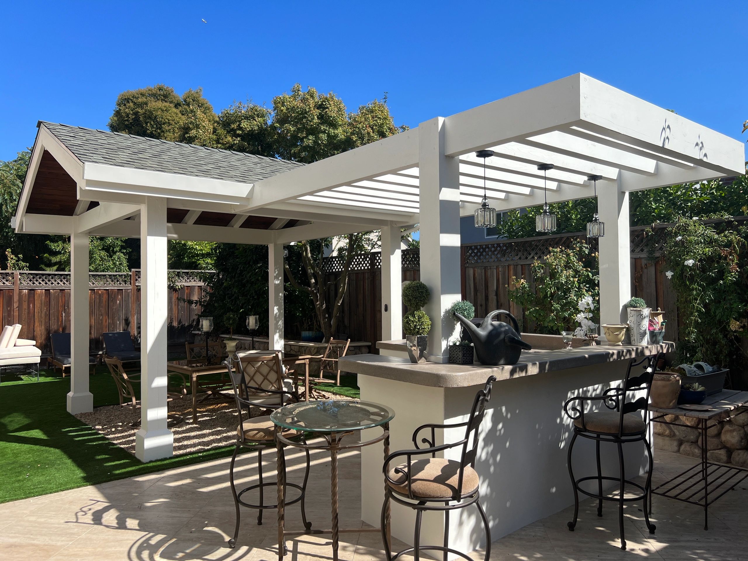 Outdoor patio with pergola and bar