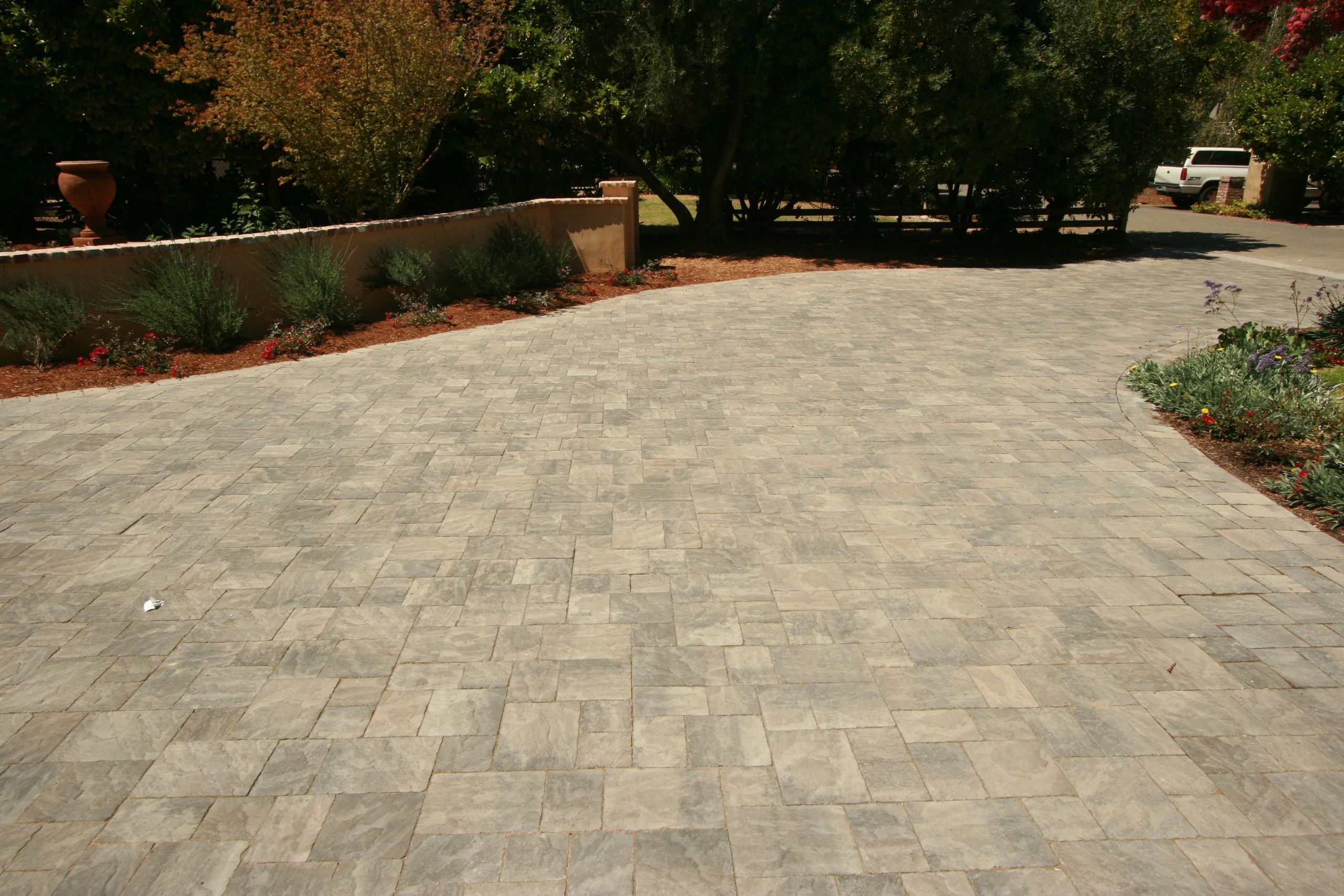 Spacious driveway with stone pavers