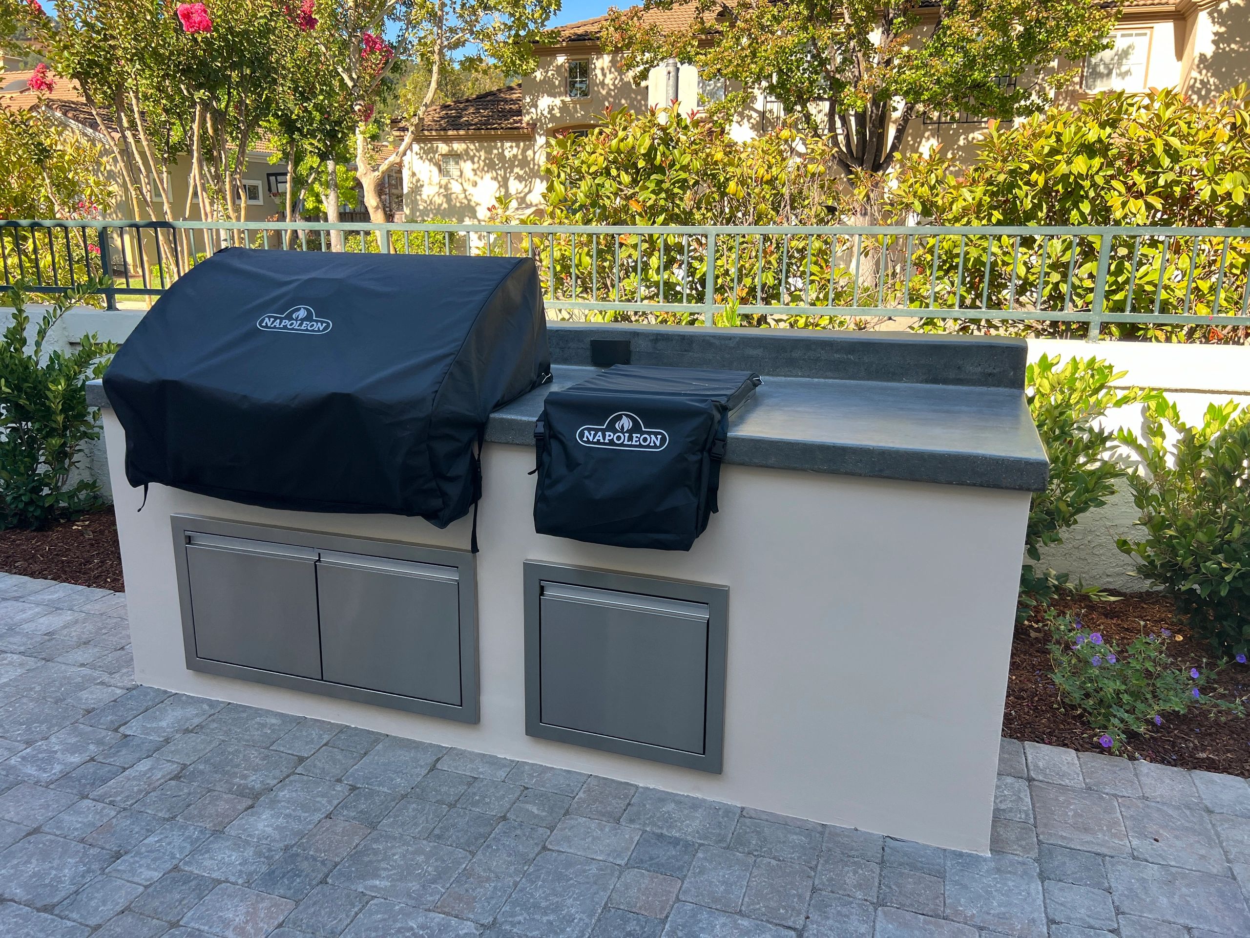 Backyard kitchen area with grill setup