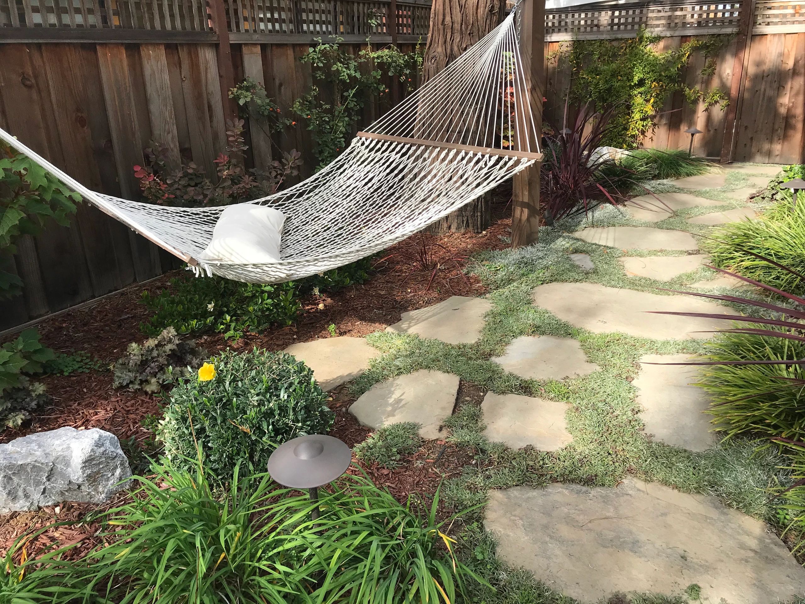 Relaxing hammock in landscaped garden