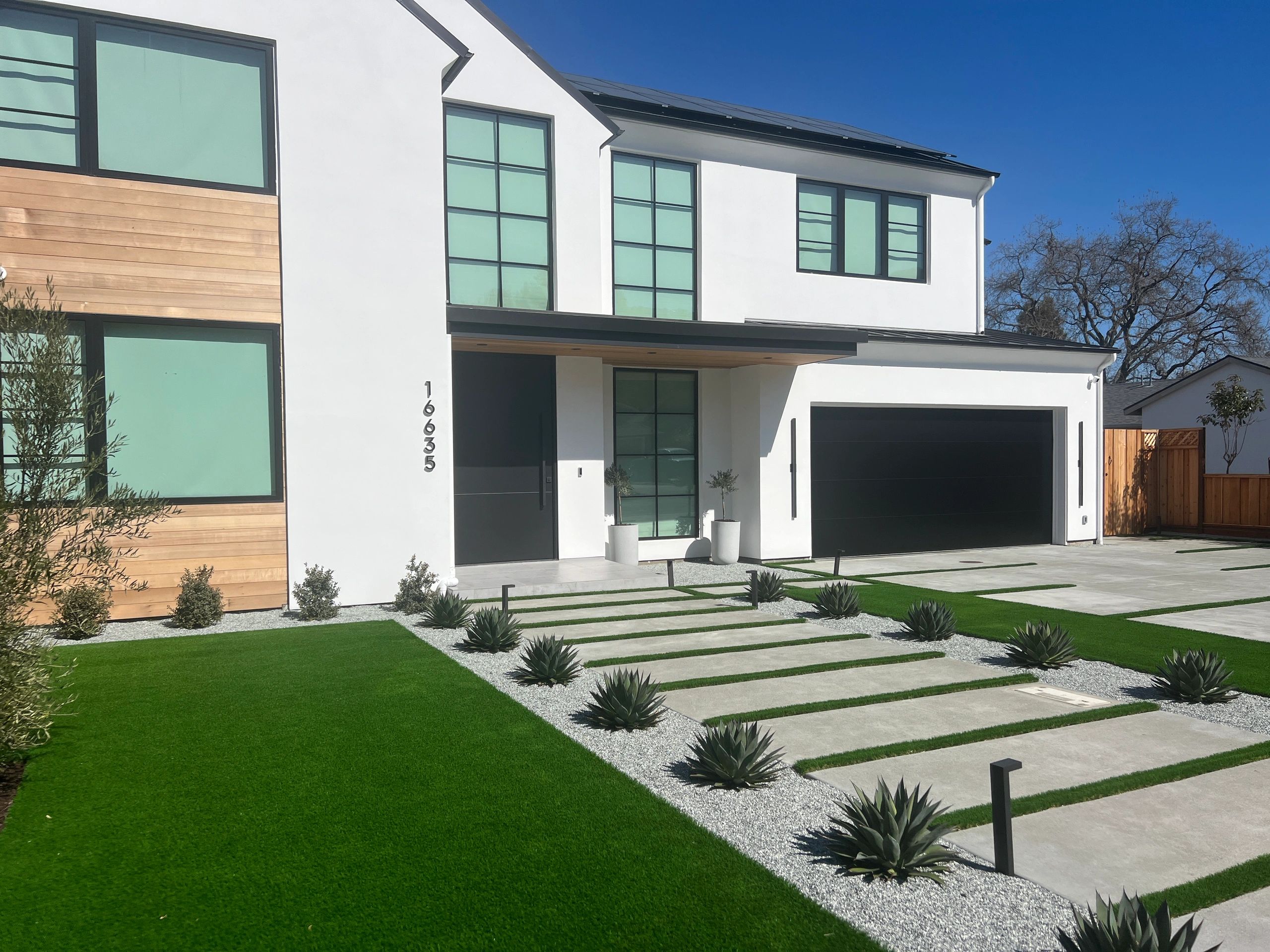 Modern white house with landscaped yard