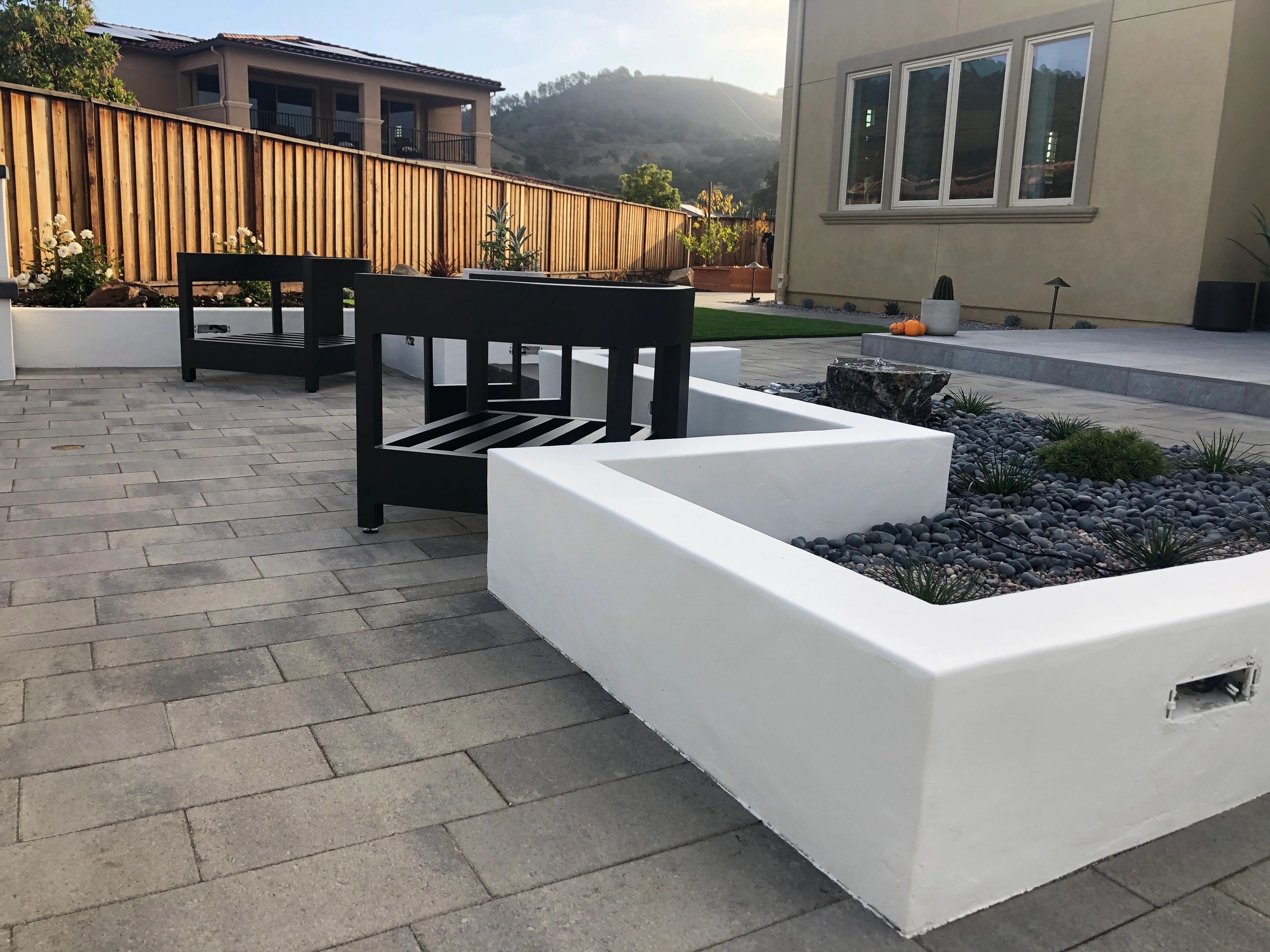 Contemporary backyard with garden beds