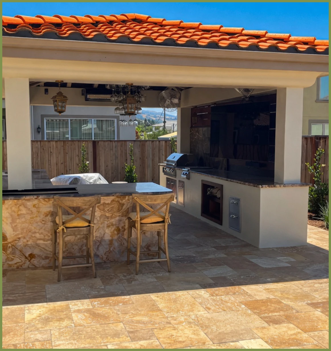 Outdoor kitchen with bar stools