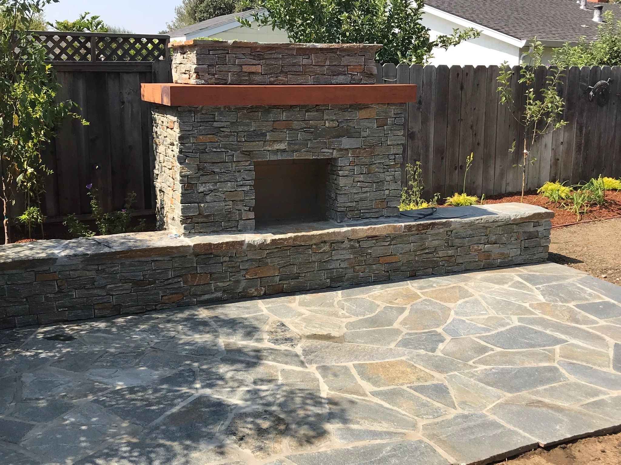Stone fireplace in garden setting