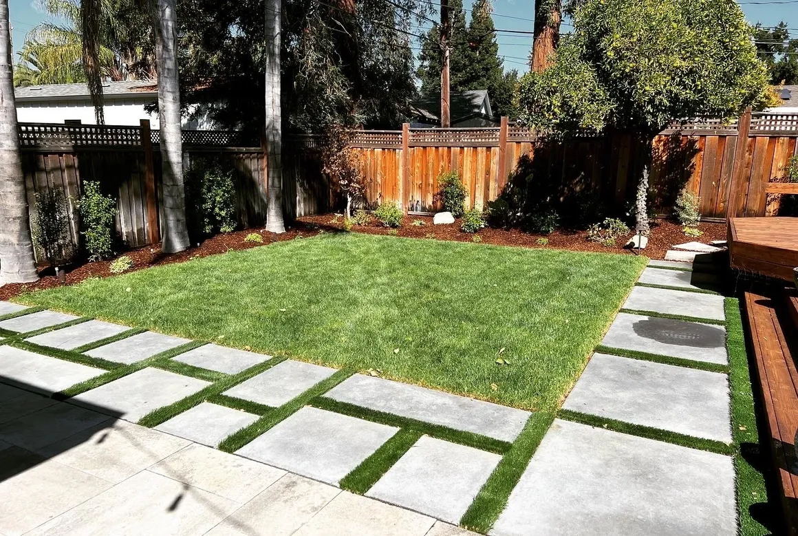 Modern garden with stone path and grass