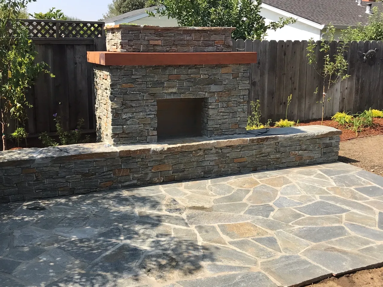 Backyard stone fireplace setup