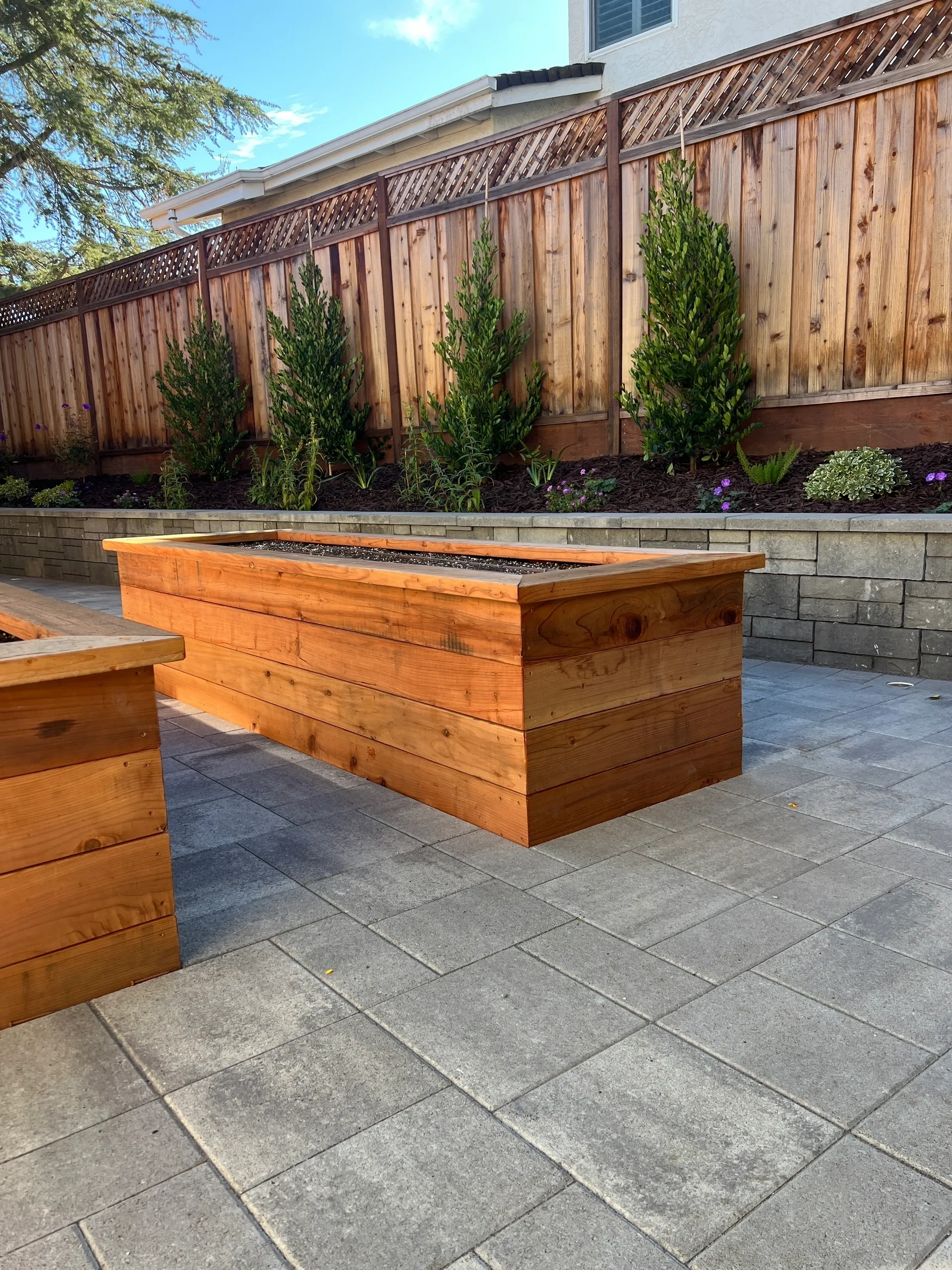 Outdoor seating with wooden planter boxes