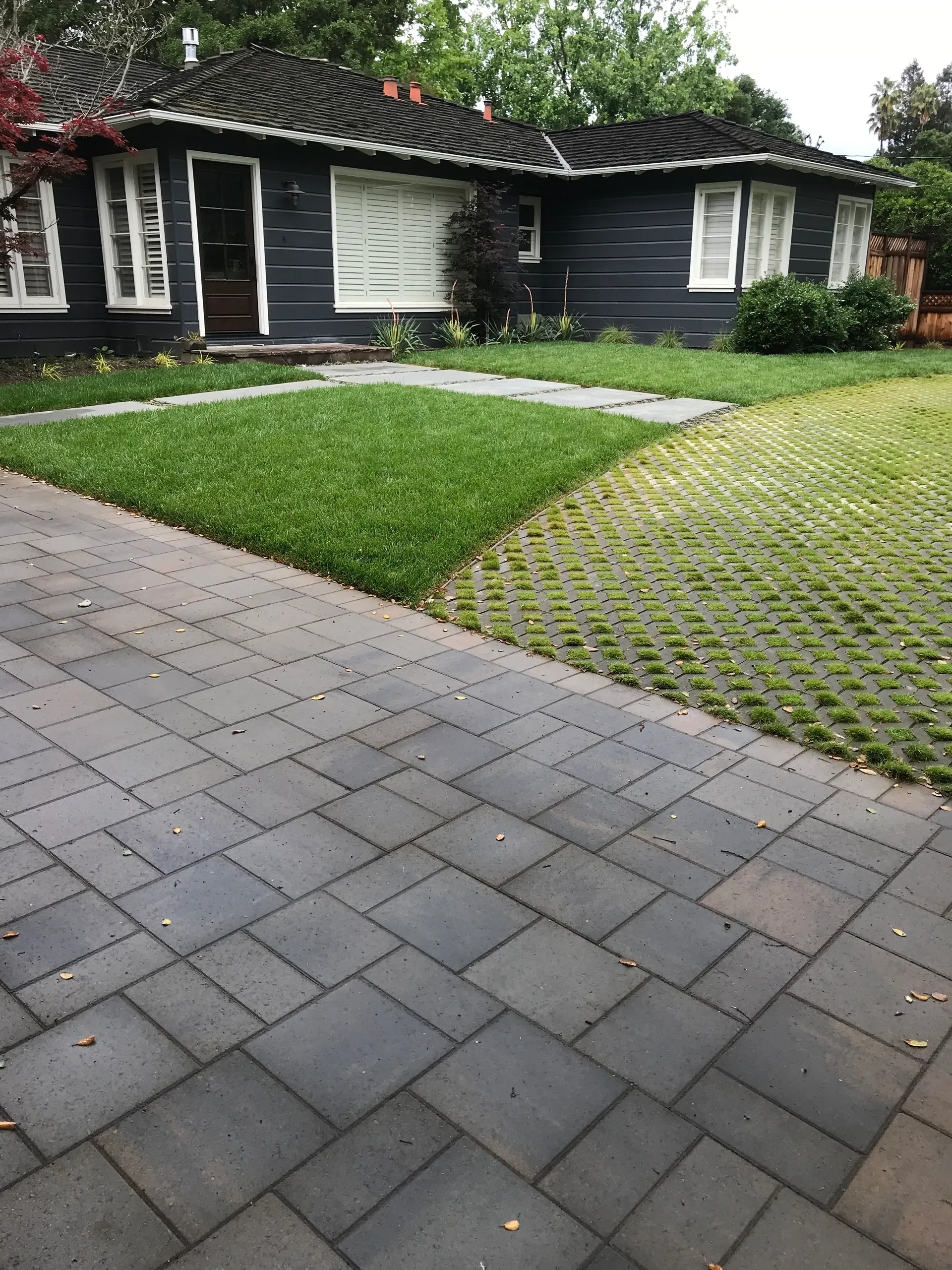 Modern house with green lawn and pathway